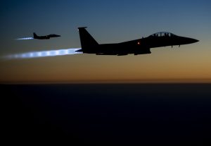 A pair of USAF F-15E Strike Eagles return to Iraq after conducting airstrikes in Syria, September 2014.