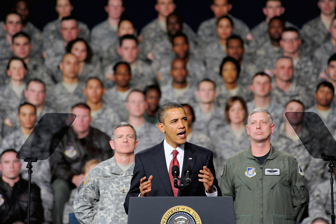 Former president Barack Obama delivering remarks to soldiers.